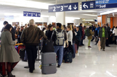 Passengers queue at a check-in desk, on April 8, 2015 at Orly airport, outside Paris, as hundreds of flights to and from France were expected to be cancelled today as air traffic controllers launched a two-day strike over working conditions.    The civil aviation authority has asked airlines to scrap around 40 percent of flights, warning of "disruption across the whole country. AFP PHOTO / THOMAS SAMSON